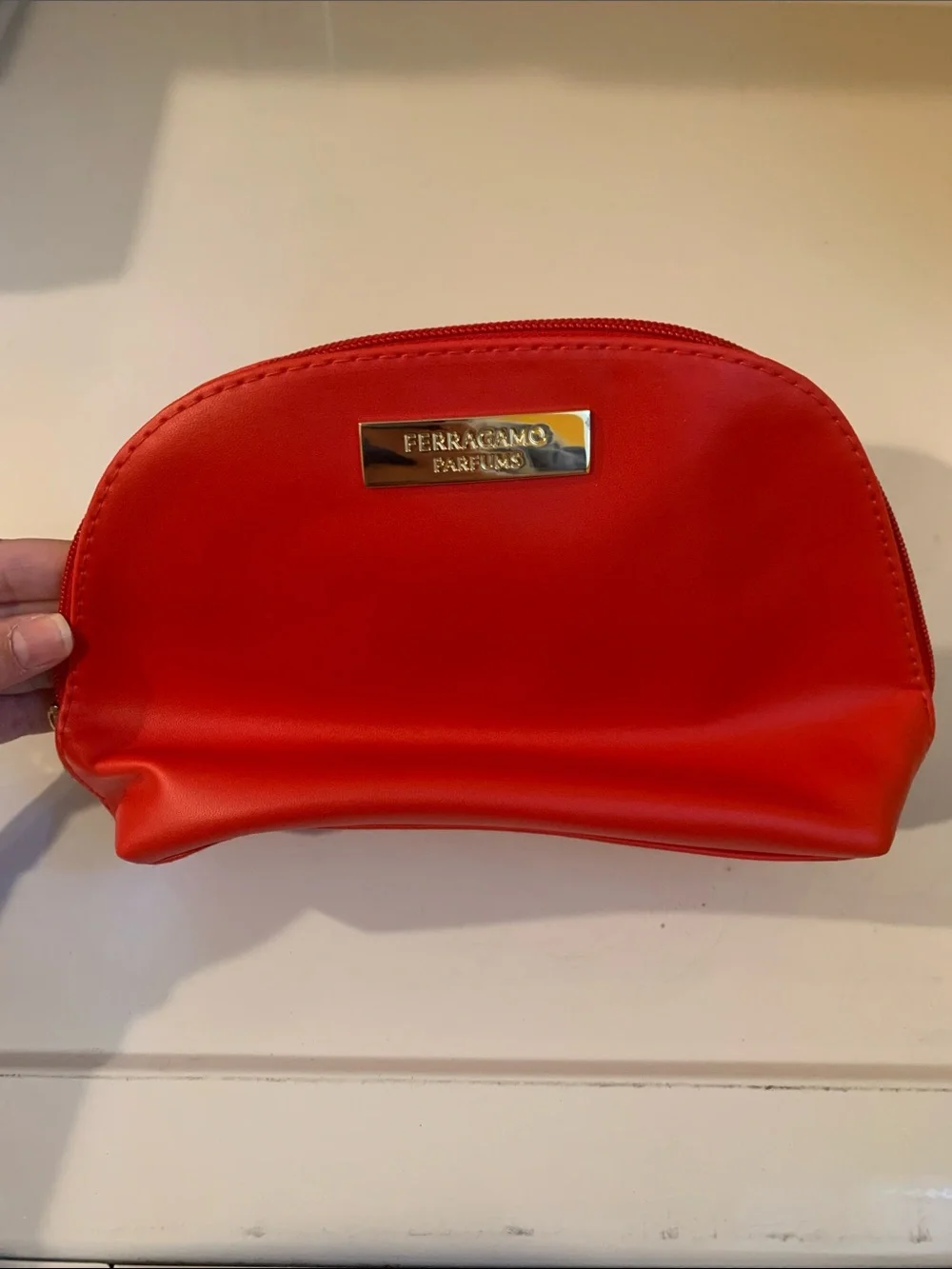 NWOT Salvatore Ferragamo Parfums Red Cosmetic Case with Gold Logo Plaque